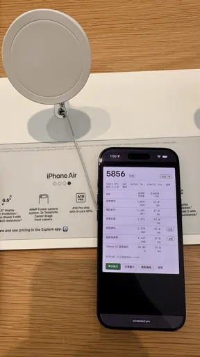 iPhone Air in an Apple Store showing a Screen Test Pro score of 5856 under benchmark 2.1.0